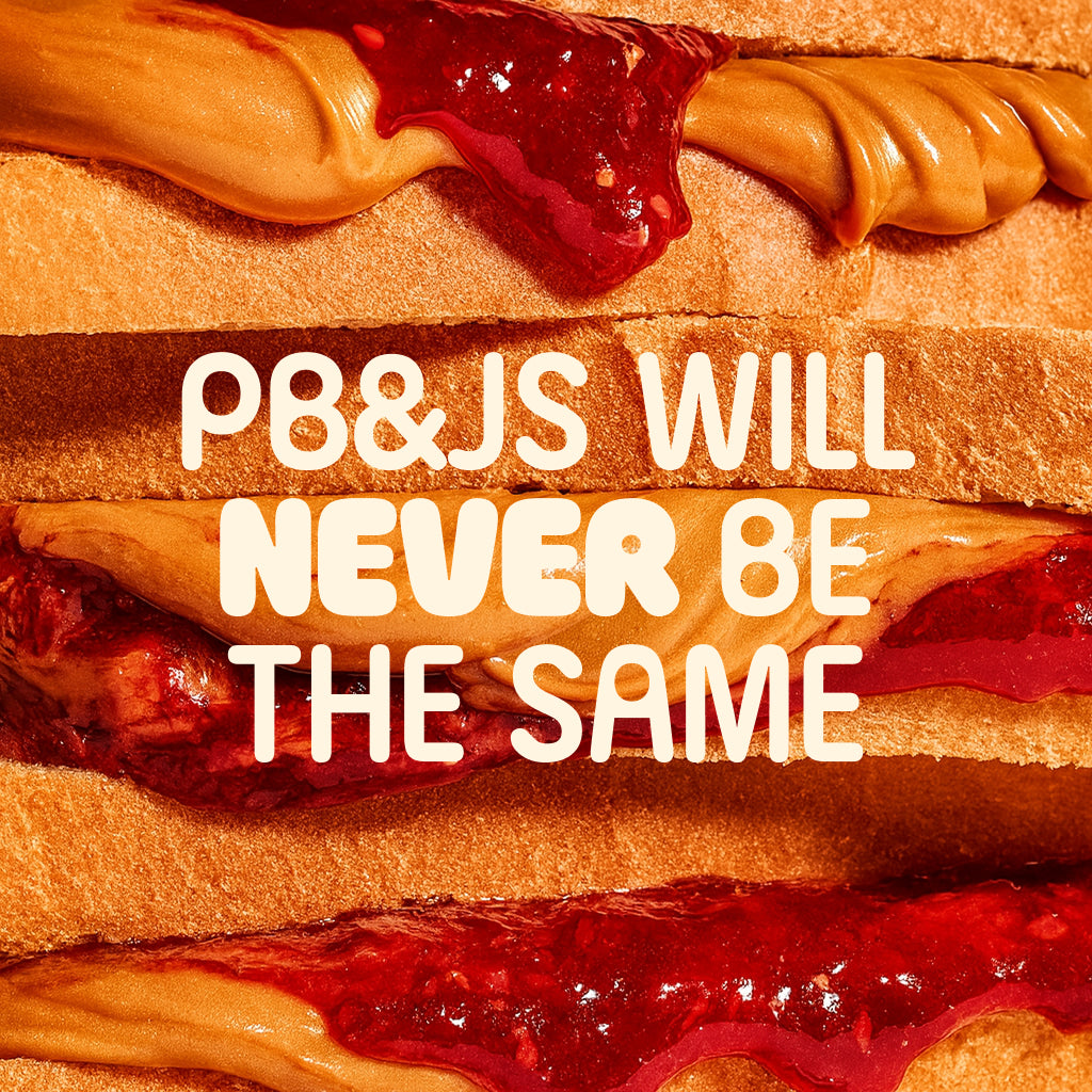 Close-up of a peanut butter and jelly sandwich with text overlay 'PB&JS WILL NEVER BE THE SAME'.